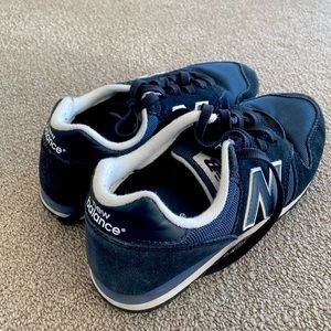 Blue New Balance 373 sneakers